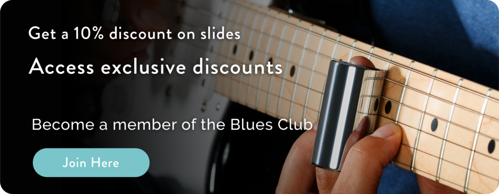 When playing the slide guitar, the musician wears a slide tube on the
